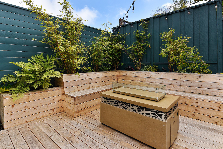 Inside Out Landscaping hardscape project with wood planters and modern grill in San Francisco